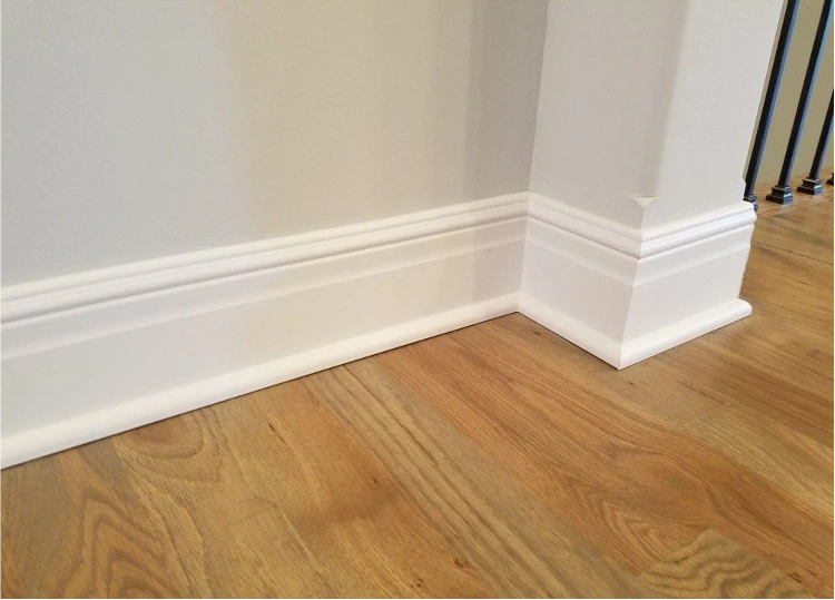 White-coated MDF skirting board